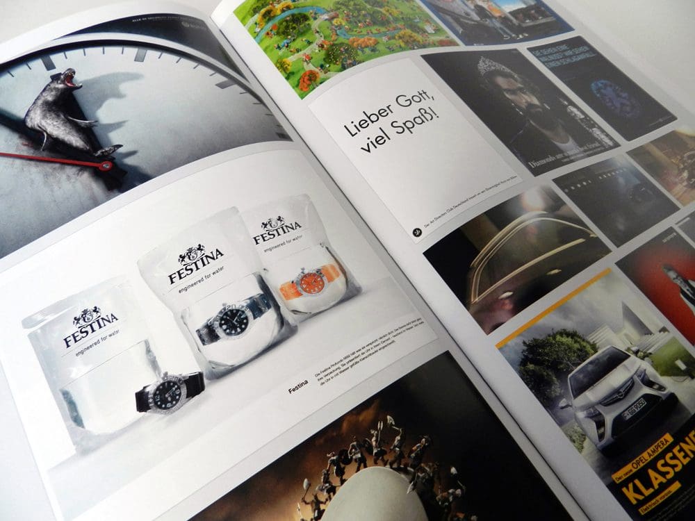 Watches displayed in glass containers on a magazine page.