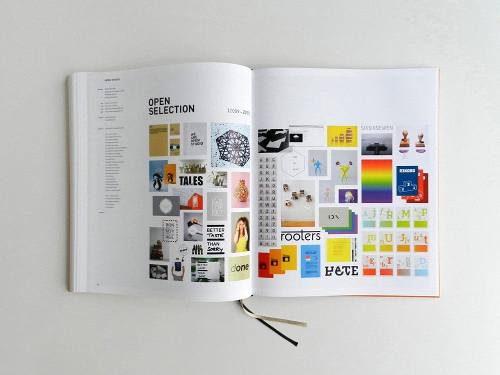 An open book displaying colorful graphic designs and project titles.