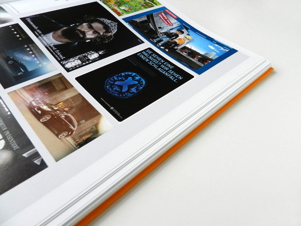 Open magazine showing various images and graphics on pages.