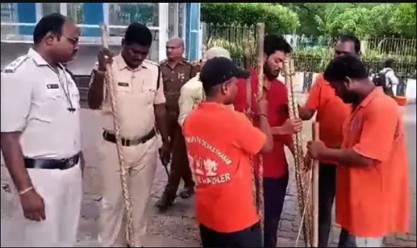 TTD staff being provided sticks to keep the trekking route safe and the stick are long as seen here. (TTD photo)