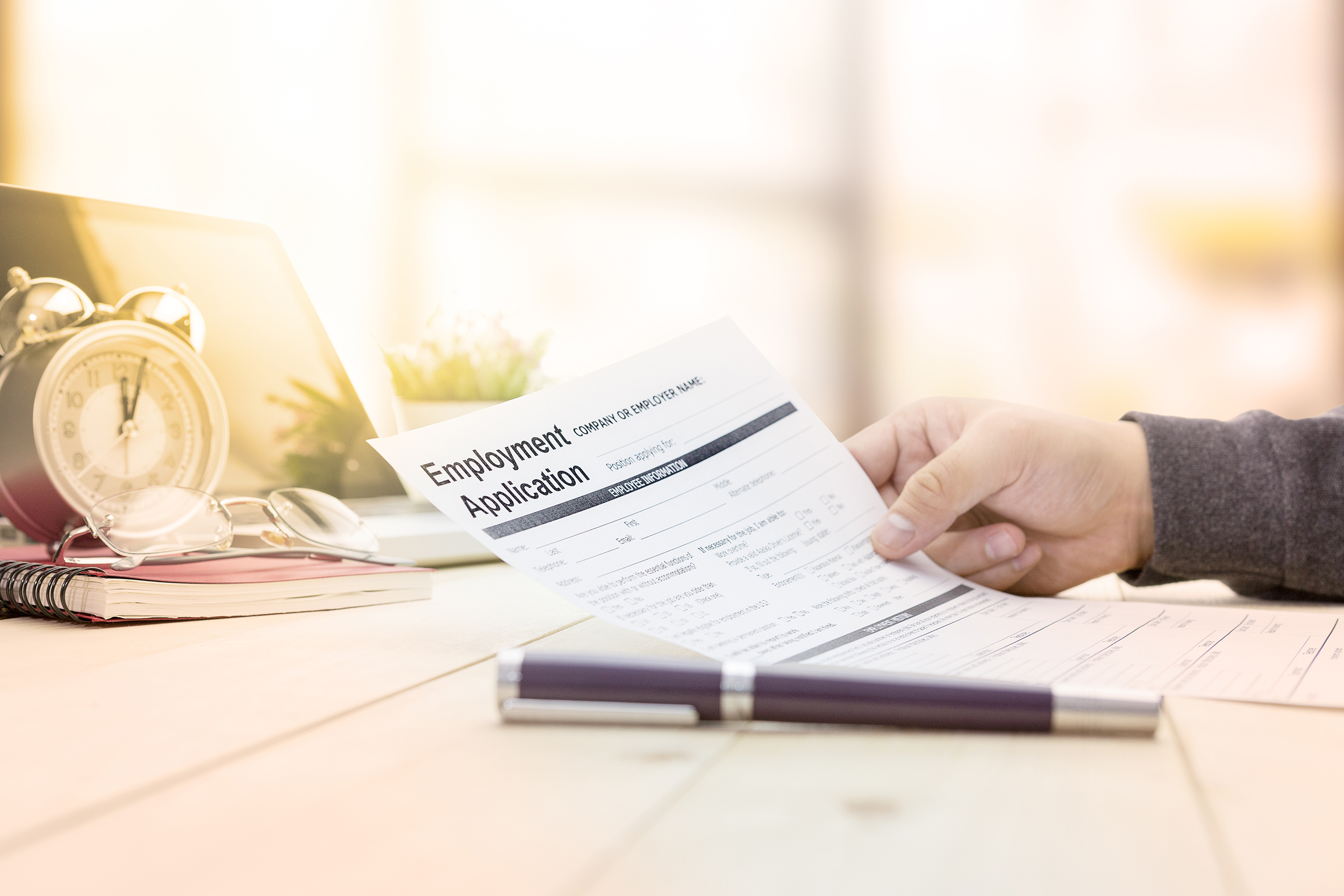 Businessman or job seeker fill in Employment Application form wi