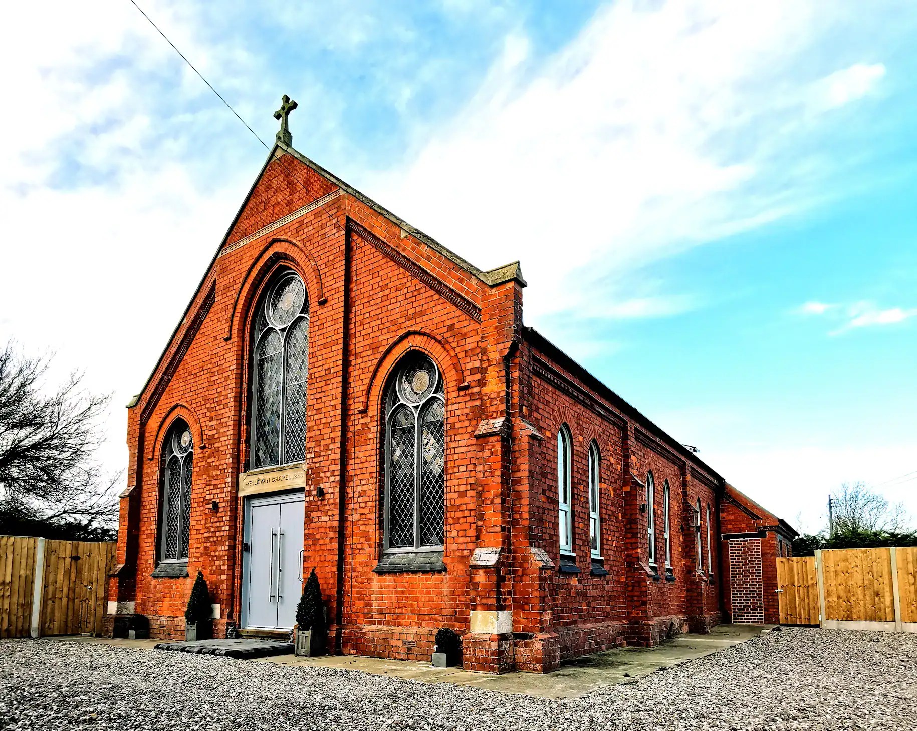 Elegant aluminium windows enhancing historic church architecture.