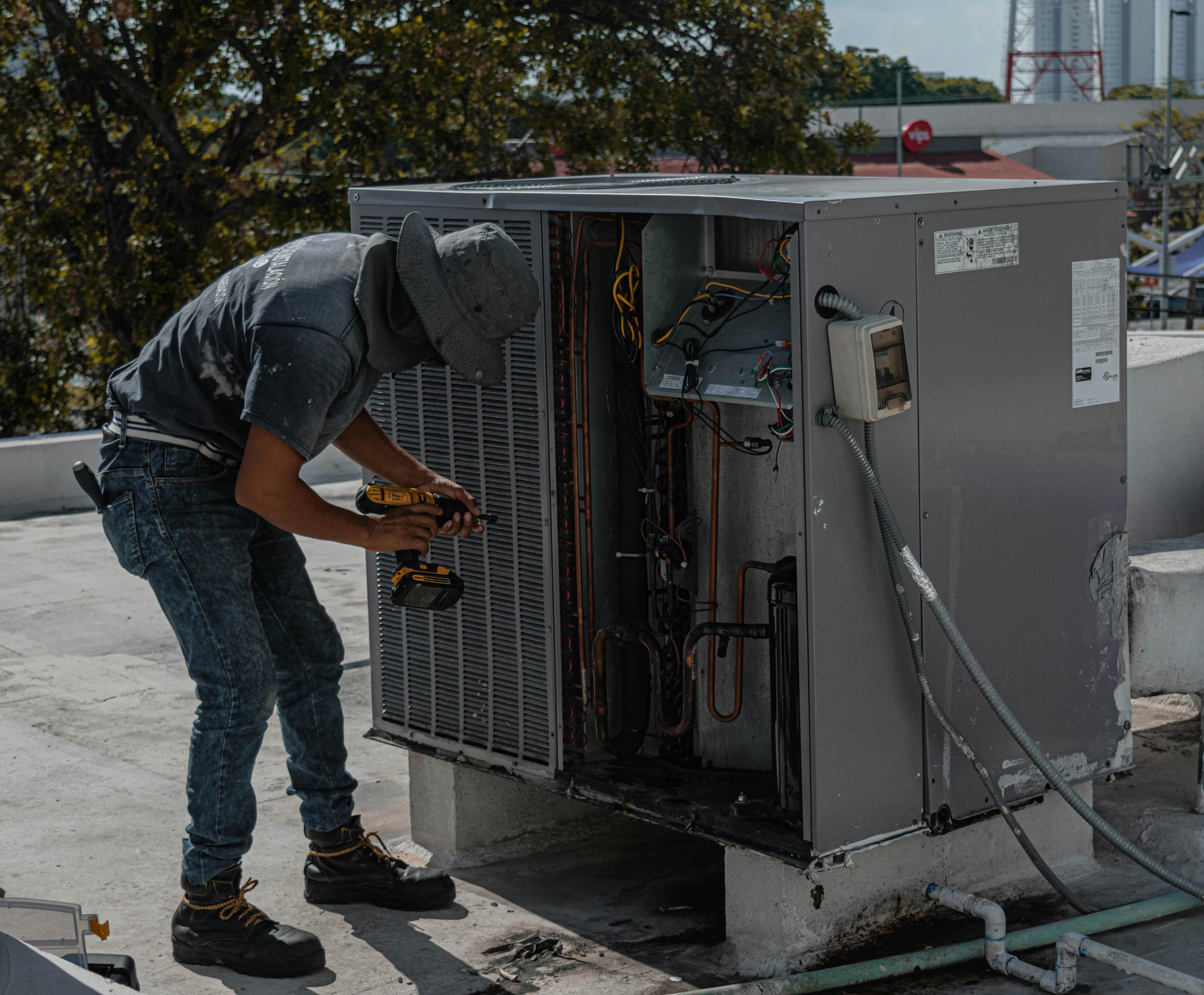 HVAC technician working on an air conditioning unit