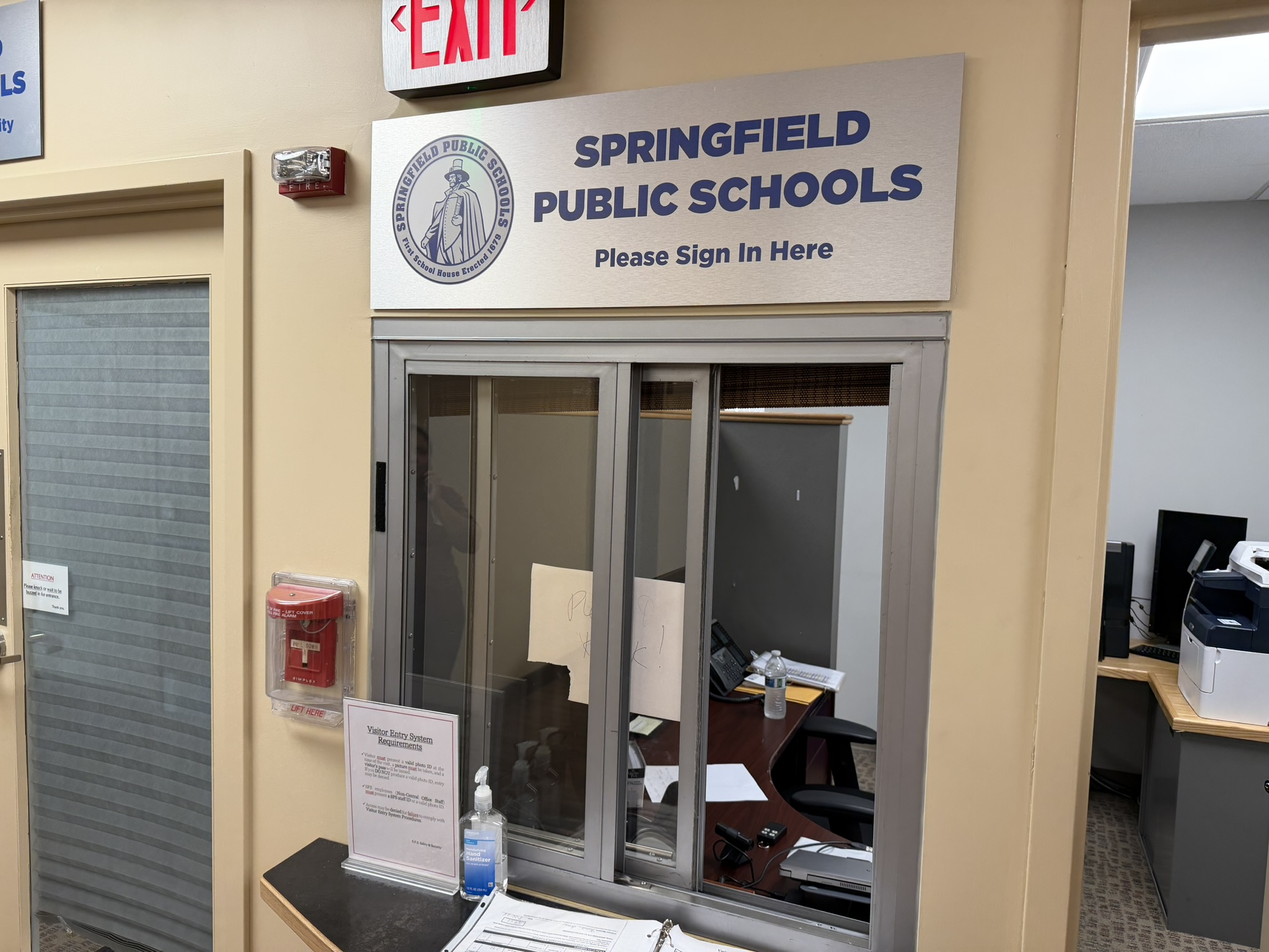 A visitor check-in window inside Springfield Public Schools headquarters in Springfield, Massachusetts.