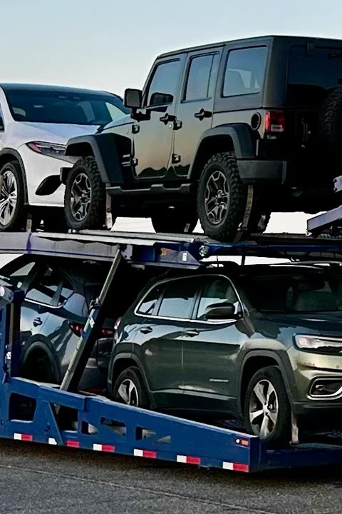 Vehicles loaded on an open car carrier for nationwide auto transport