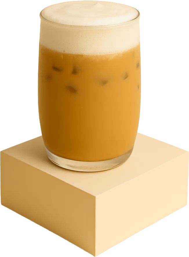 A glass of iced toffee latte topped with creamy foam, placed on a beige podium with a smooth and premium