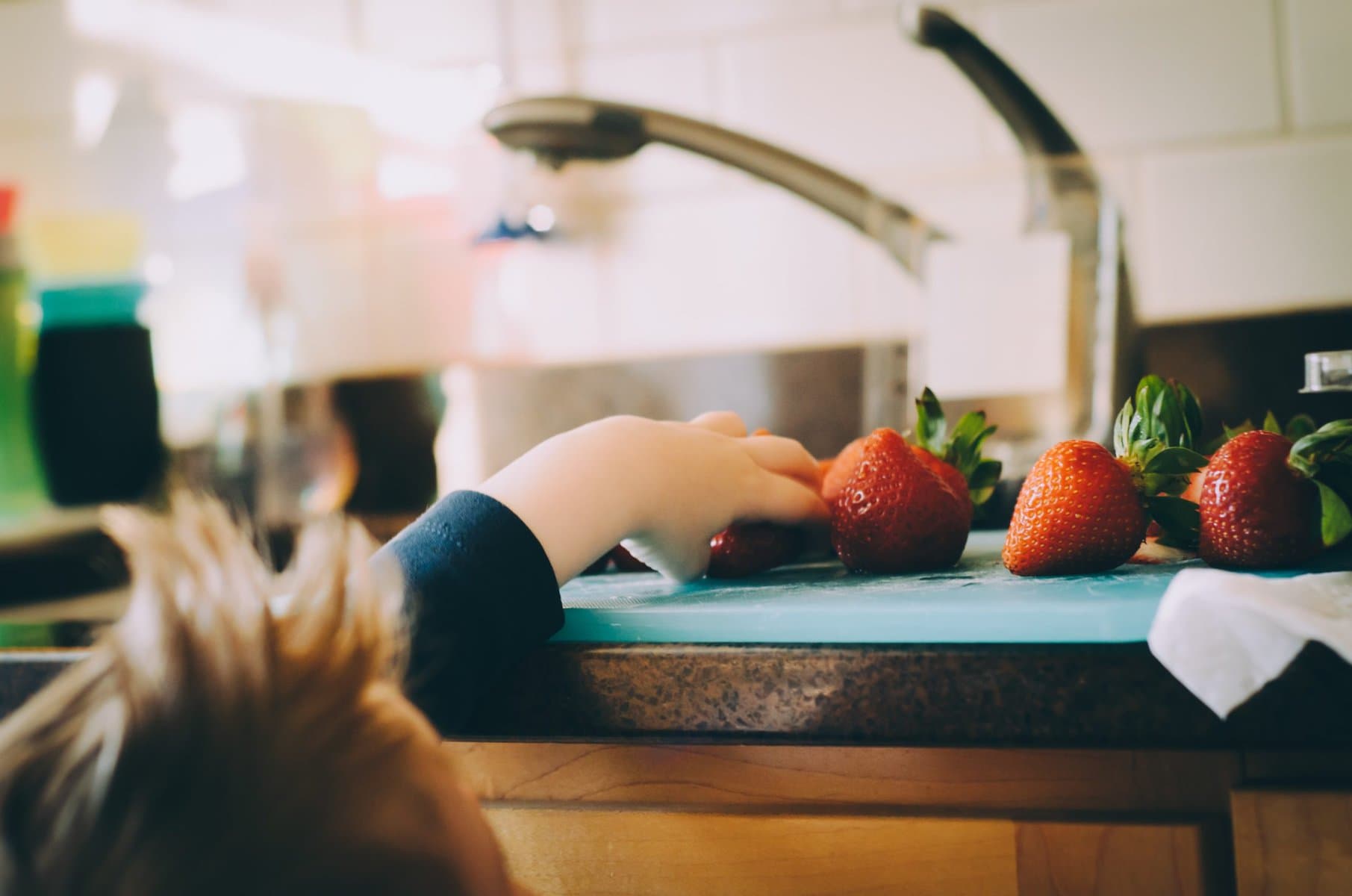 Accepting Help during or after a divorce can help you regain your balance and, like this little girl reaching for strawberries, get your hands around your new life