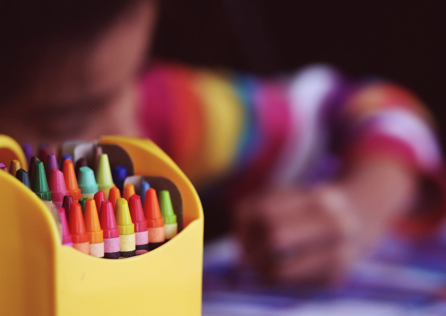 a box of crayons to illustrate the offer of back to school planning for parents after divorce