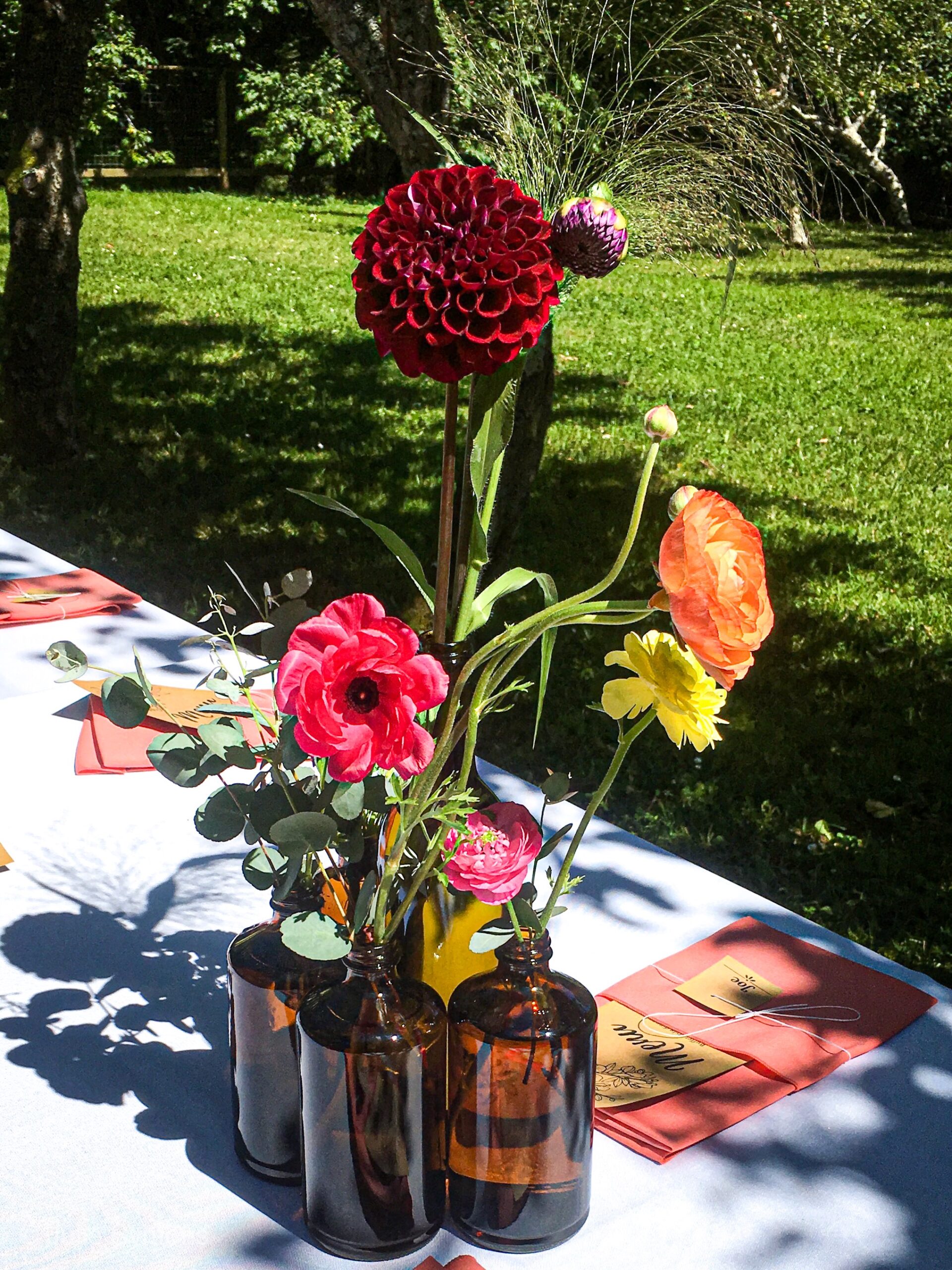 Flowers in recycled jars.