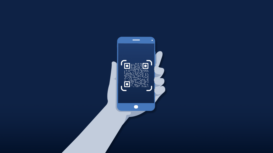 Hand holding a phone with a QR code