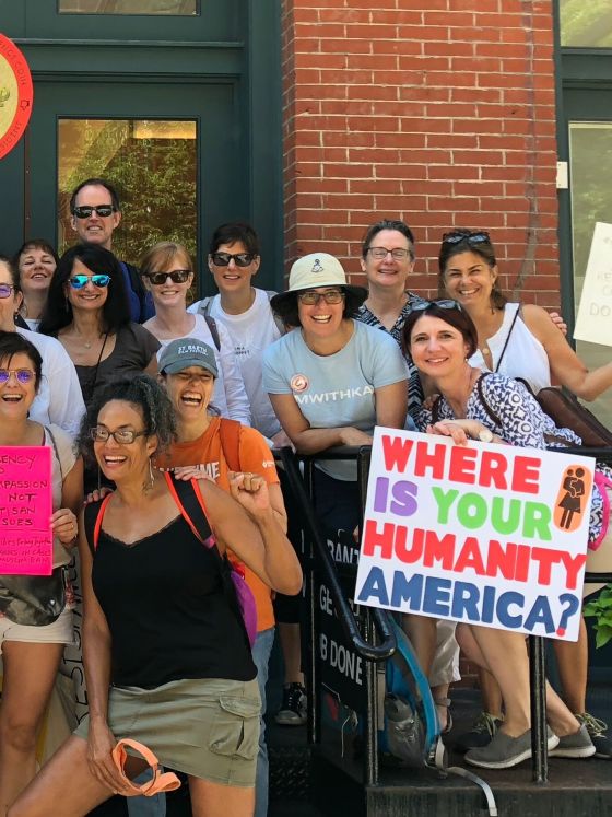 Protest outside with sign