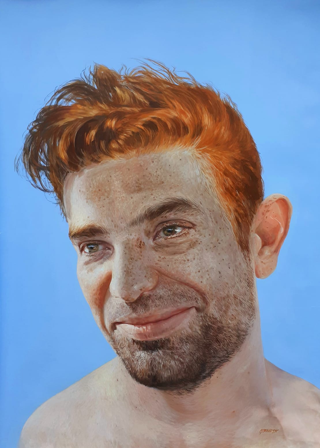 Portrait of a ginger man on blue background