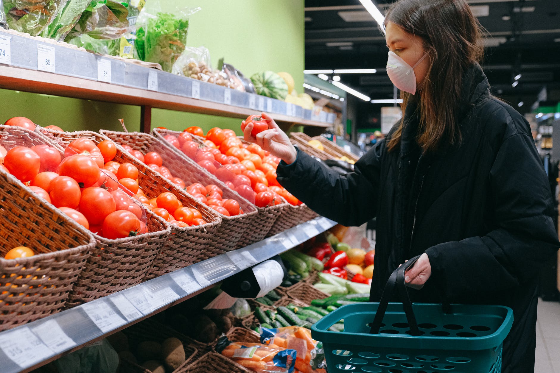 woman in face mask shopping in supermarket