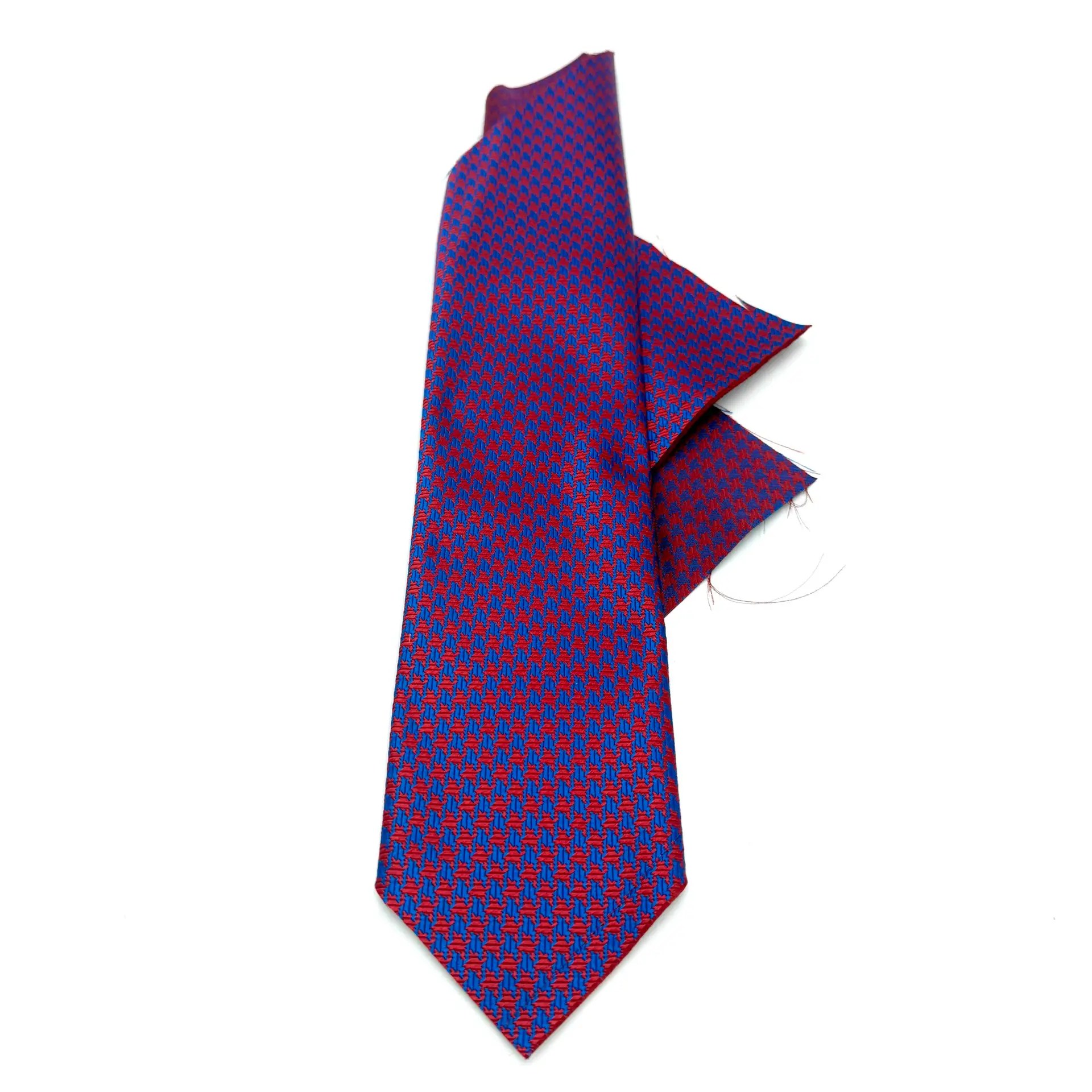 Custom red geo pattern woven silk tie fabric in textured red and blue geometric weave.