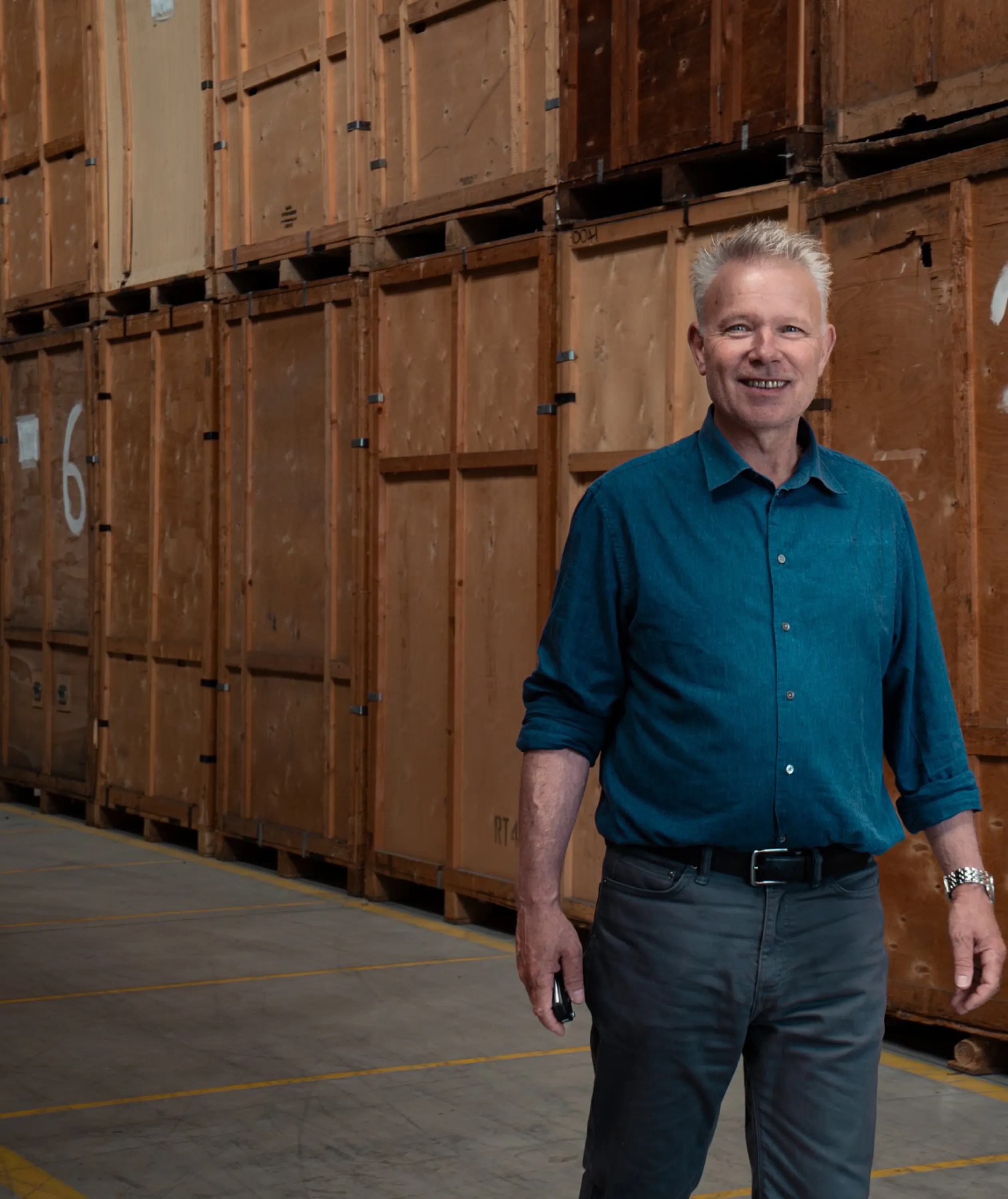 Greg Hollis beside containerised storage at the Dolphin warehouse