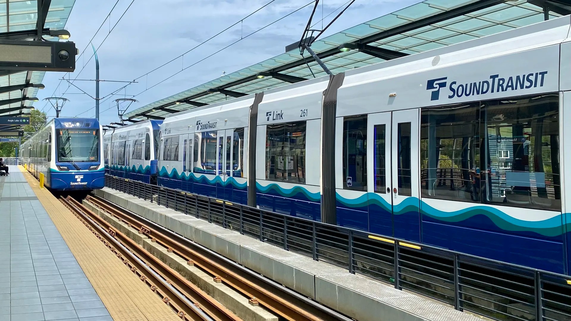 An image of 2 Sound Transit light rail trains at the station.