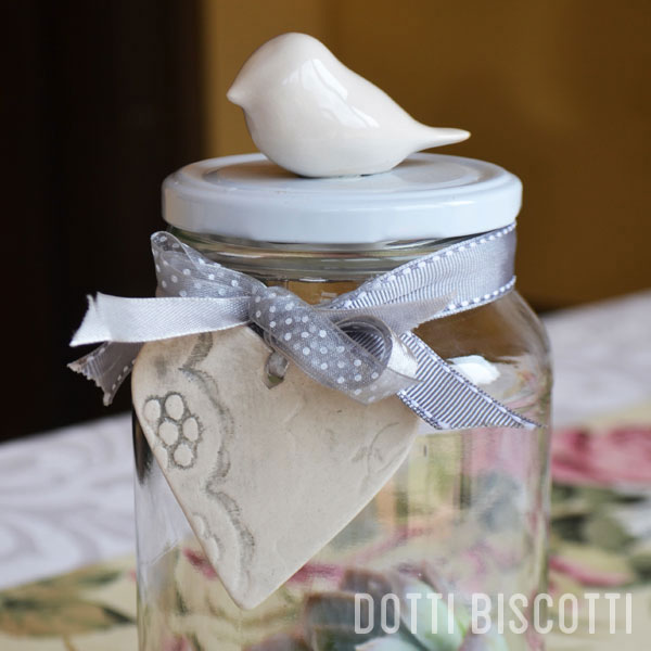 Mini Ceramic Bird-topped Glass Jar with Ceramic Heart Tag. Available: 12