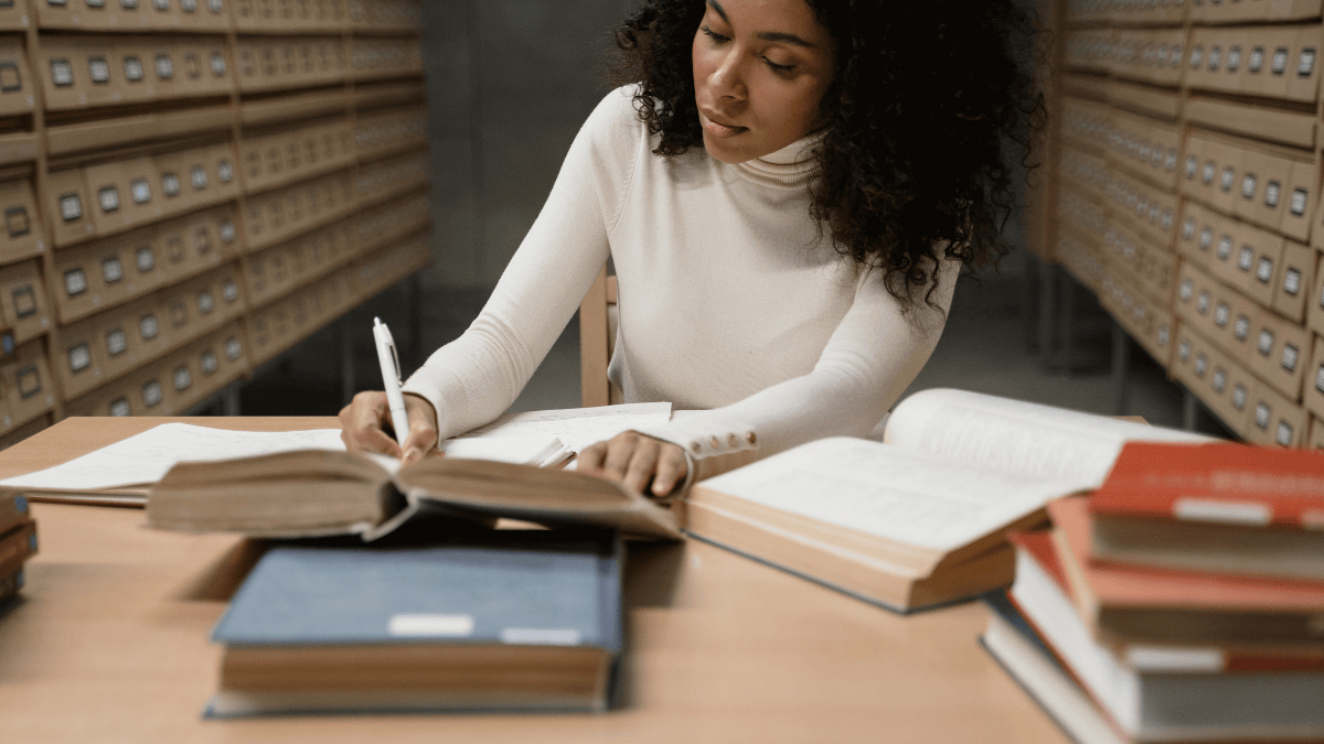 On notepad or on your phone writing questions for 6 week postpartum checkup