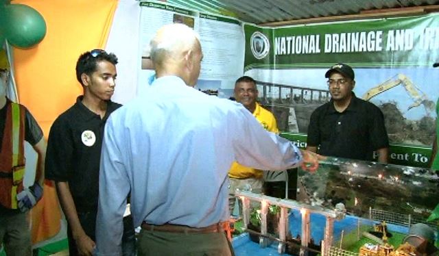 Minister of Communities Ronald Bulkan checks out the National Drainage and Irrigation Authority (NDIA) booth at Essequibo Night 2016
