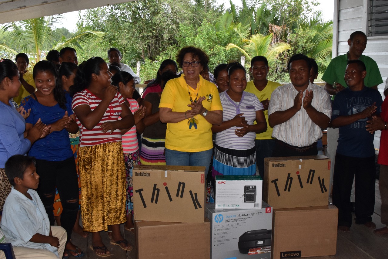 Minister within the Ministry of Indigenous Peoples’ Affairs Valerie Garrido-Lowe (left) presenting equipment to CDC Chairperson Sherwin Lewis of Smith Creek and HEYS participants