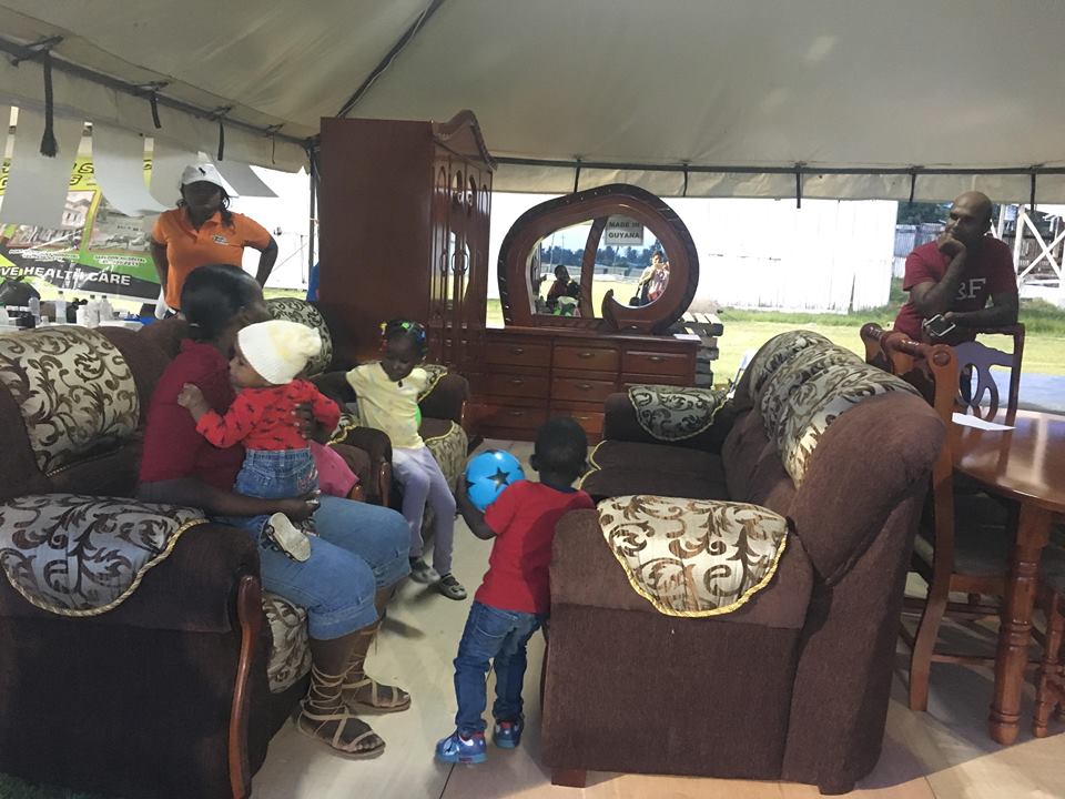 A family testing out the comfort of a locally produced suite