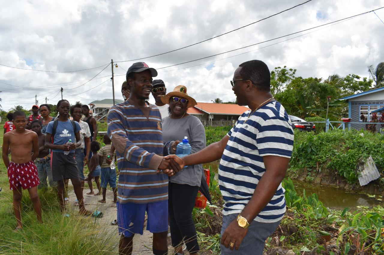 Deputy Commissioner of Police, Paul Williams greeting a resident of Sophia