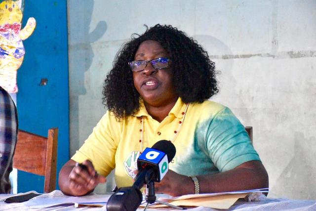 Minister within the Ministry of Public Health, Dr. Karen Cummings speaking with residents at the Moco Moco Primary School during the outreach.