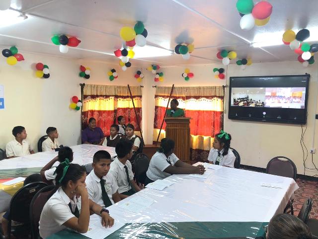 Minister of Education, Dr. Nicolette Henry addressing the students of the Arapaima Primary and St. Ignatius Secondary schools.