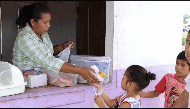 Sonita Earnest serving one of her young customers