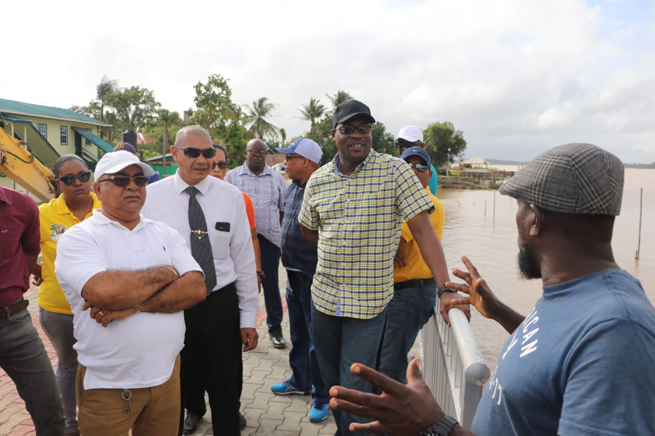 Minister of Public Infrastructure, David Patterson being thanked by a resident of the region for the initiative