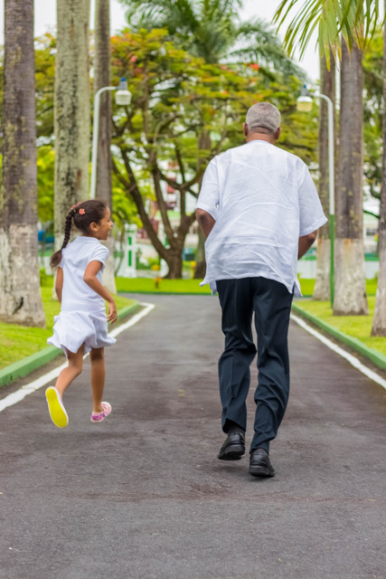 A race!!!!! President David Granger runs with his granddaughter Faraa Gaskin in the compound of State House.