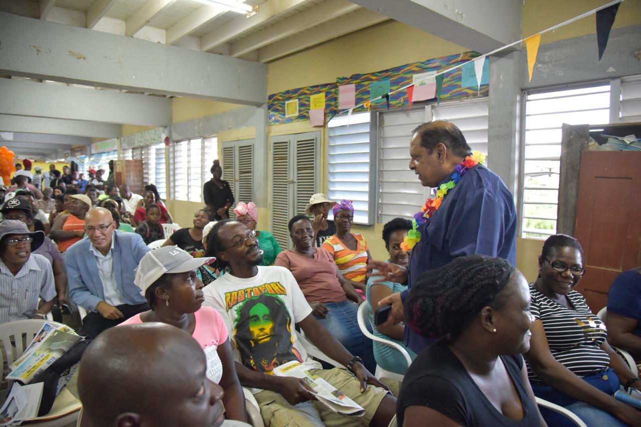 Prime Minister, Moses Nagamootoo chatting with residents before the community meeting at Enmore starts.