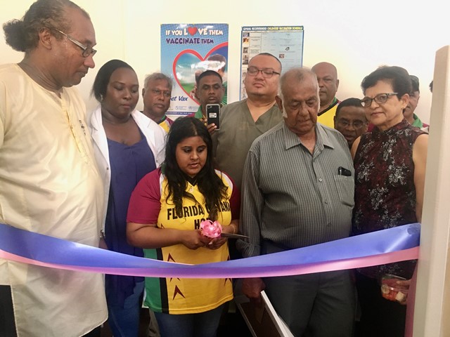 Staff of the Skeldon Hospital and members of the Florida Guyana Hope Inc. cut the ceremonial ribbon with Focal Point Coordinator, Alex Foster [left].