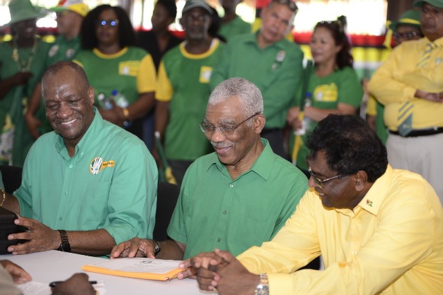 (from left) Directory general Minister of the Presidency Joseph Harmon, His excellency President David Granger and Prime Ministerial candidate and Minister of Public Security Khemraj Ramjattan as they prepare to submit the list of candidates for the APNU+AFC.