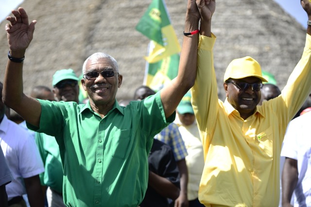 A confident team: His Excellency President David Granger and Prime Ministerial candidate and Minister of Public Security Khemraj Ramjattan emerge from the Umana Yana after submitting their list of candidates.