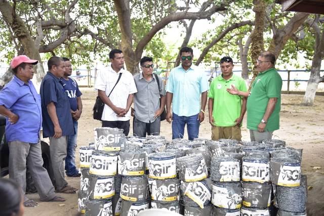 Minister of Indigenous Peoples’ Affairs, Hon. Sydney Allicock handing over materials for fencing of farm lands to the Toshaos.