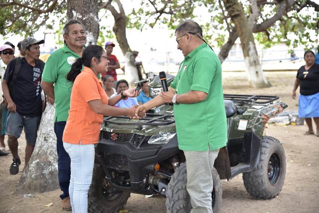 Minister of Indigenous Peoples’ Affairs, Hon. Sydney Allicock handing over the keys to the ATV to the Community Development Officer.