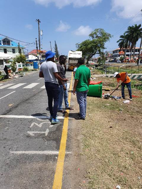 City Council sanitation workers busy clearing along Irving Street Georgetown.