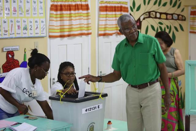 HE President David Granger casts his ballot at the Pearl Nursery School, East Bank Demerara.