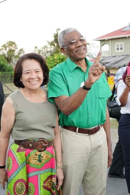 President David Granger shows his inked finger to indicate he has voted. He is accompanied by his wife First Lady Mrs. Sandra Granger