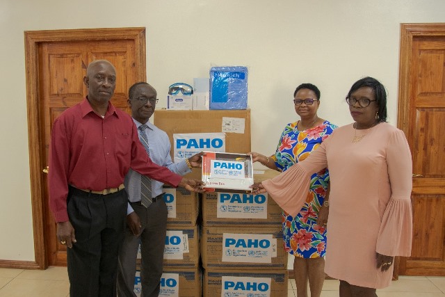 PAHO hands over PPEs:(from left to right) Coordinator, HEOC, Dr. Collin James, PAHO/WHO Country Representative, Dr. William Adu-Krow, Minister of Public Health, Volda Lawrence and Permanent Secretary, MoPH, Colette Adams.