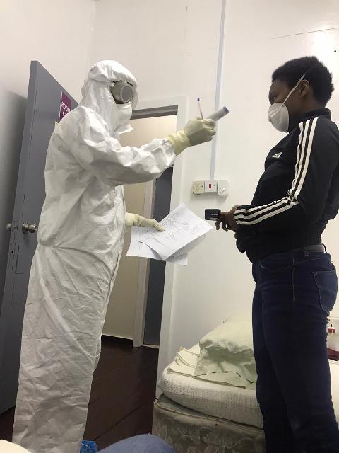 Delicia’s Sister being screened and monitored by one of the healthcare professionals while under isolation conditions (Source: Delicia George)