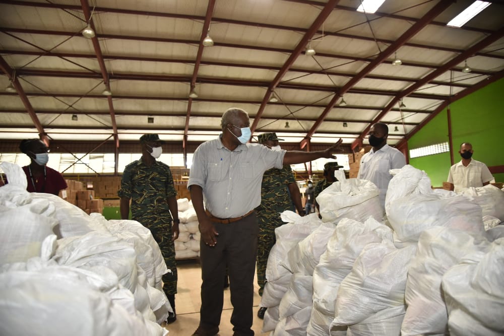 Prime Minister, Hon. (ret’d) Brigadier Mark Phillips inspecting some of the COVID relief hampers