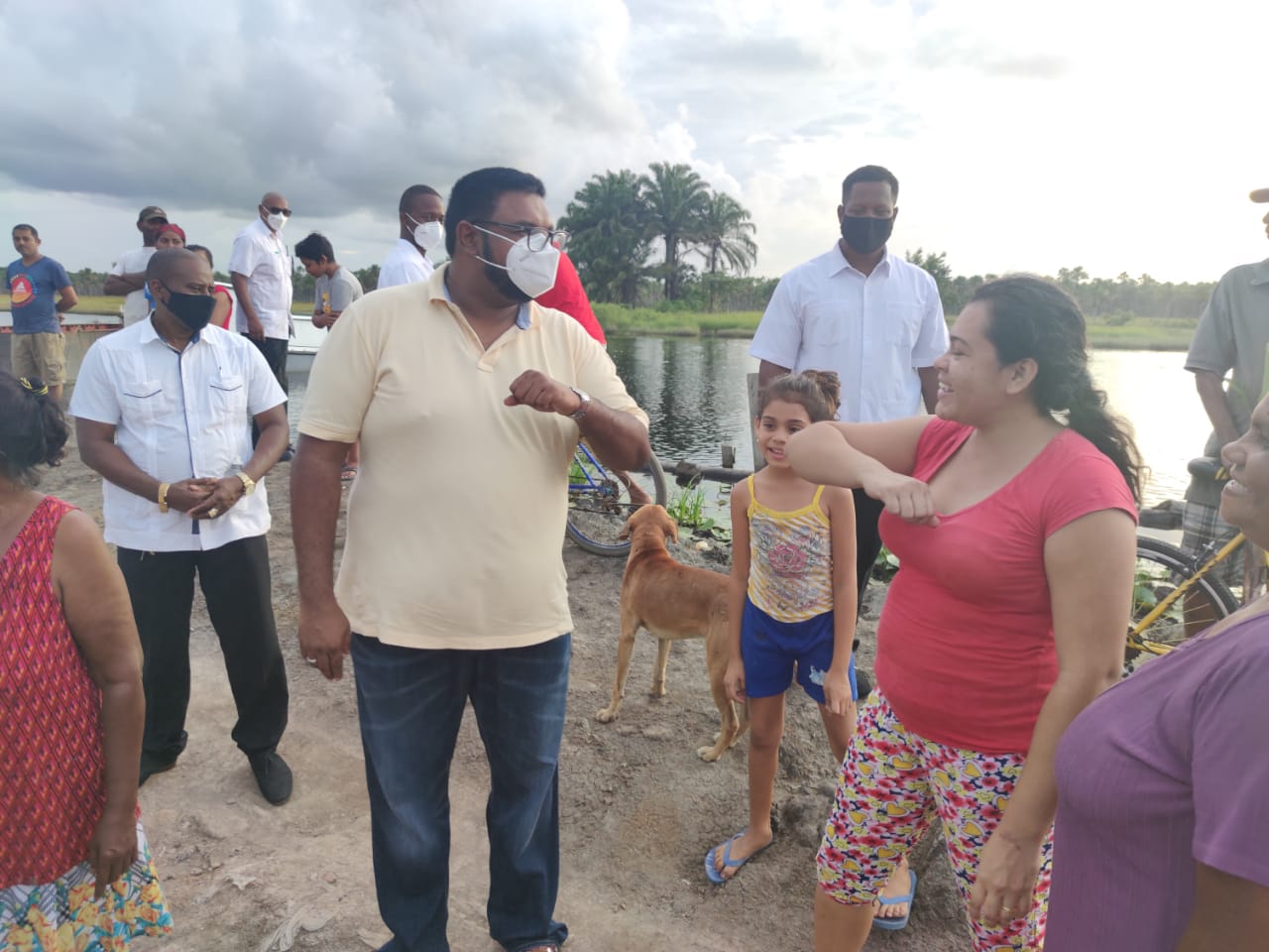 His Excellency, Dr, Mohamed Irfaan Ali, greets residents in keeping with the health and safety protocols.