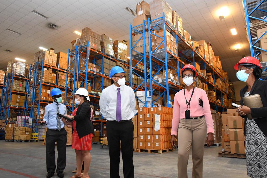 Minister of Health, Hon. Dr. Frank Anthony, accompanied by PAHO/WHO Representative, Dr. William Adu Krow,[extreme left] and staff of the Supplies Chain Management Unit in Diamond, EBD