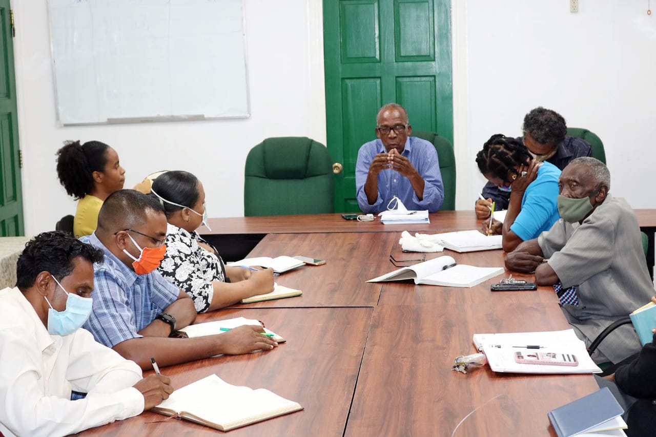 Labour 2: Minister of Labour, Hon. Joseph Hamilton, and staff of the Ministry of Labour during their first meeting.