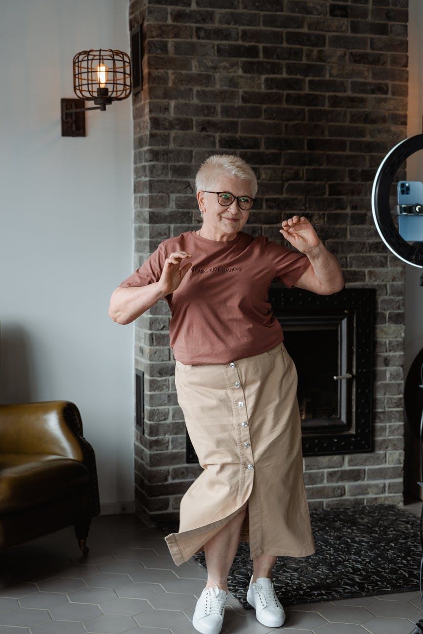 woman dancing in front of a phone