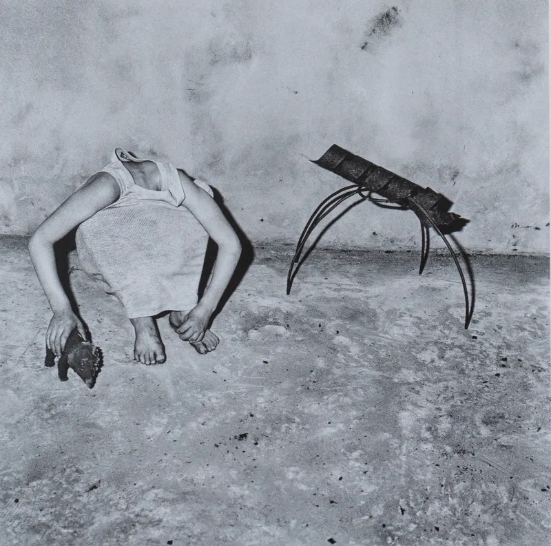 Roger Ballen, Head Inside Shirt, 2001, black and white photograph, a figure obscured inside a shirt in Ballen's characteristic surreal and psychologically charged style