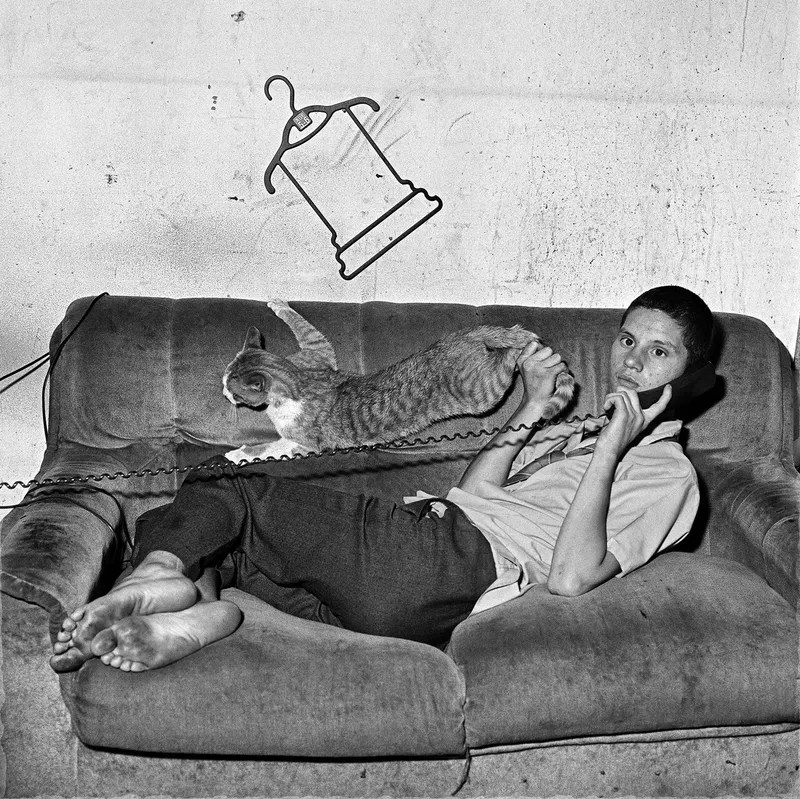 Roger Ballen, Eugene on the Phone, 2000, black and white photograph, a figure in a stark interior holding a telephone