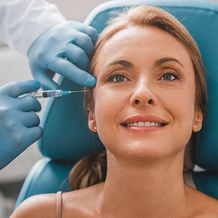Botox injection on face demonstrating cosmetic rejuvenation treatment.